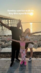 Alex Rodriguez with his daughters on the beach