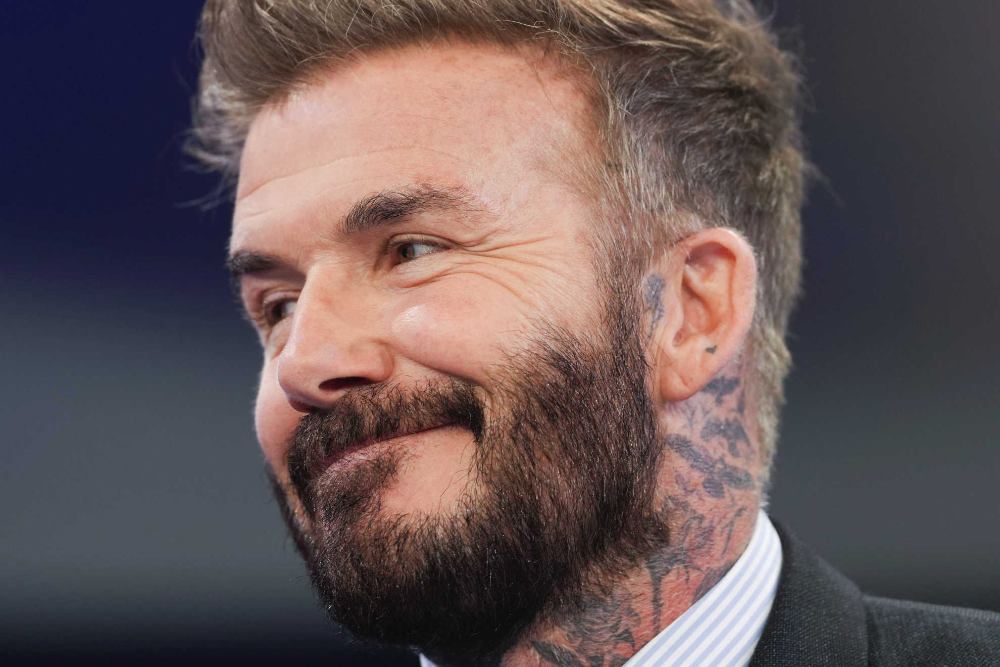 David Beckham performs a circus trick commonly seen in the kitchen much to Victoria Beckhams delight